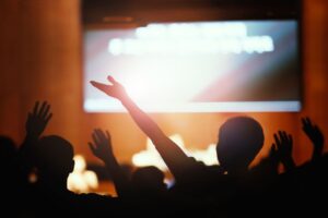 passionate-worship-with-hands-raised-praising-graceful-church-prayer-time-background