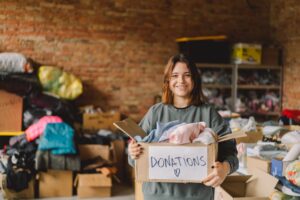volunteer-teengirl-preparing-donation-boxes-people